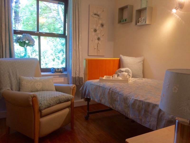 bedroom with chair next to the bed