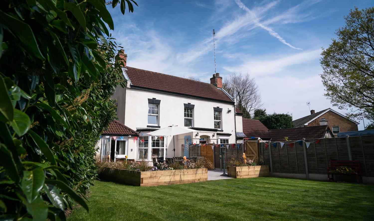 exterior of our house from the back with a view of our garden