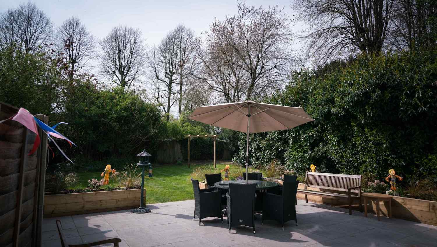 garden furniture under an umbrella outside our home